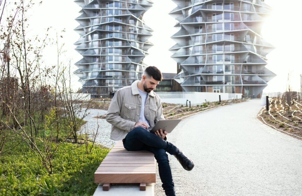 A man using laptop sitting on a desk 