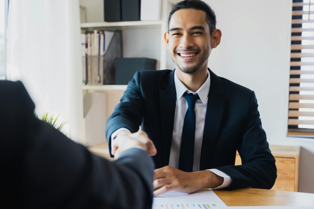 successful job interview, two man shake hand to celebration partnership and teamwork, business deal